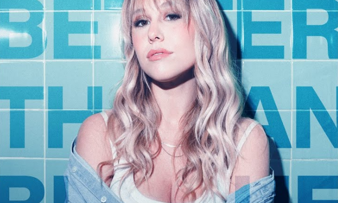Singer Dayna Reid posing against wall with Better than Blue text